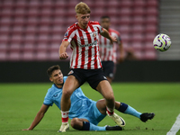 David Osipov of Athletic Club Bilbao tackles Tom Watson of Sunderland during the Premier League International Cup Group B match between Sund...