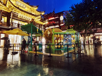 Tourists view the area amid heavy rain affected by a typhoon in Shanghai, China, on September 10, 2024. (