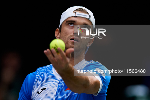 Tomas Machac of Czechia serves against Carlos Alcaraz of Spain during the 2024 Davis Cup Group B Stage match between Czechia and Spain at Pa...