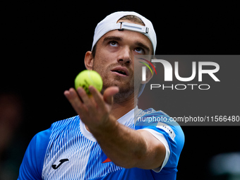 Tomas Machac of Czechia serves against Carlos Alcaraz of Spain during the 2024 Davis Cup Group B Stage match between Czechia and Spain at Pa...