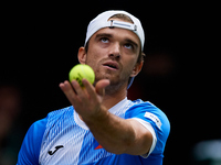 Tomas Machac of Czechia serves against Carlos Alcaraz of Spain during the 2024 Davis Cup Group B Stage match between Czechia and Spain at Pa...