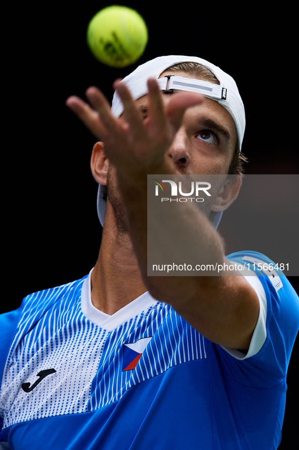 Tomas Machac of Czechia serves against Carlos Alcaraz of Spain during the 2024 Davis Cup Group B Stage match between Czechia and Spain at Pa...