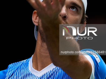 Tomas Machac of Czechia serves against Carlos Alcaraz of Spain during the 2024 Davis Cup Group B Stage match between Czechia and Spain at Pa...