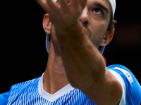 Tomas Machac of Czechia serves against Carlos Alcaraz of Spain during the 2024 Davis Cup Group B Stage match between Czechia and Spain at Pa...