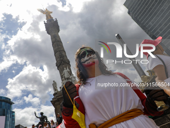 A woman participates in a protest at the Angel de la Independencia after the approval of the judicial reform to elect all judges by popular...