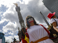 A woman participates in a protest at the Angel de la Independencia after the approval of the judicial reform to elect all judges by popular...