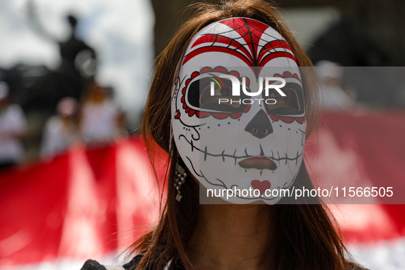 A woman participates in a protest at the Angel de la Independencia after the approval of the judicial reform to elect all judges by popular...