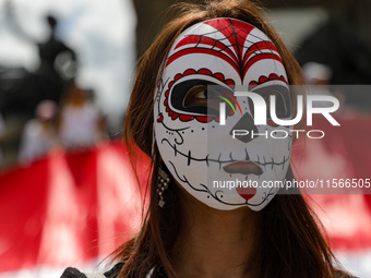 A woman participates in a protest at the Angel de la Independencia after the approval of the judicial reform to elect all judges by popular...