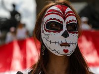 A woman participates in a protest at the Angel de la Independencia after the approval of the judicial reform to elect all judges by popular...