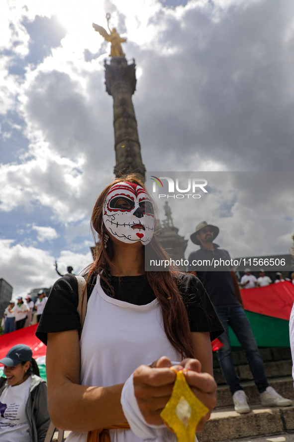 A woman participates in a protest at the Angel de la Independencia after the approval of the judicial reform to elect all judges by popular...