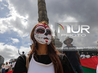 A woman participates in a protest at the Angel de la Independencia after the approval of the judicial reform to elect all judges by popular...