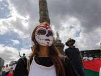 A woman participates in a protest at the Angel de la Independencia after the approval of the judicial reform to elect all judges by popular...