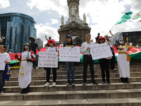 Judicial branch workers take part in a protest at the Angel de la Independencia after the approval of the judicial reform to elect all judge...