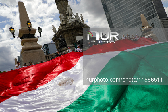 Judicial branch workers take part in a protest at the Angel de la Independencia after the approval of the judicial reform to elect all judge...