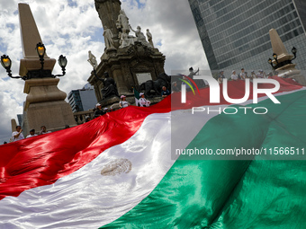 Judicial branch workers take part in a protest at the Angel de la Independencia after the approval of the judicial reform to elect all judge...