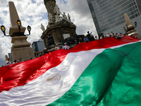 Judicial branch workers take part in a protest at the Angel de la Independencia after the approval of the judicial reform to elect all judge...