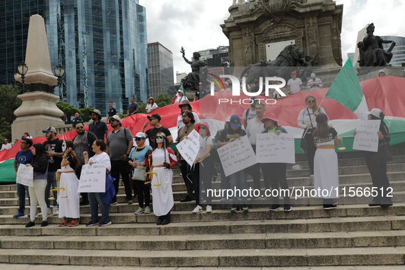 Judicial branch workers take part in a protest at the Angel de la Independencia after the approval of the judicial reform to elect all judge...