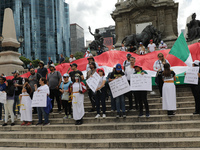 Judicial branch workers take part in a protest at the Angel de la Independencia after the approval of the judicial reform to elect all judge...