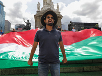 A person takes part in a protest at the Angel de la Independencia after the approval of the judicial reform to elect all judges by popular v...