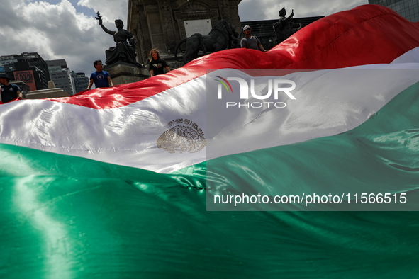 Judicial branch workers take part in a protest at the Angel de la Independencia after the approval of the judicial reform to elect all judge...