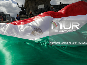 Judicial branch workers take part in a protest at the Angel de la Independencia after the approval of the judicial reform to elect all judge...