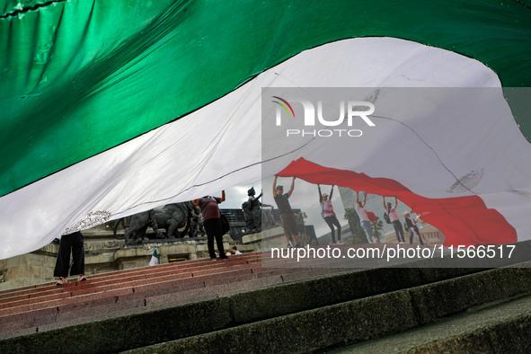 Judicial branch workers take part in a protest at the Angel de la Independencia after the approval of the judicial reform to elect all judge...