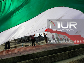 Judicial branch workers take part in a protest at the Angel de la Independencia after the approval of the judicial reform to elect all judge...