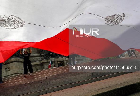 Judicial branch workers take part in a protest at the Angel de la Independencia after the approval of the judicial reform to elect all judge...