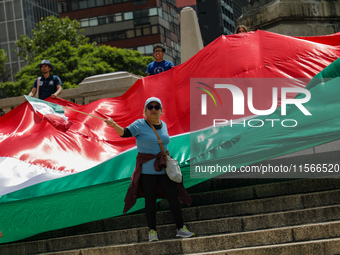 Judicial branch workers take part in a protest at the Angel de la Independencia after the approval of the judicial reform to elect all judge...