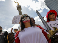 A woman participates in a protest at the Angel de la Independencia after the approval of the judicial reform to elect all judges by popular...