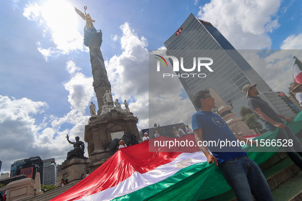 Judicial branch workers take part in a protest at the Angel de la Independencia after the approval of the judicial reform to elect all judge...