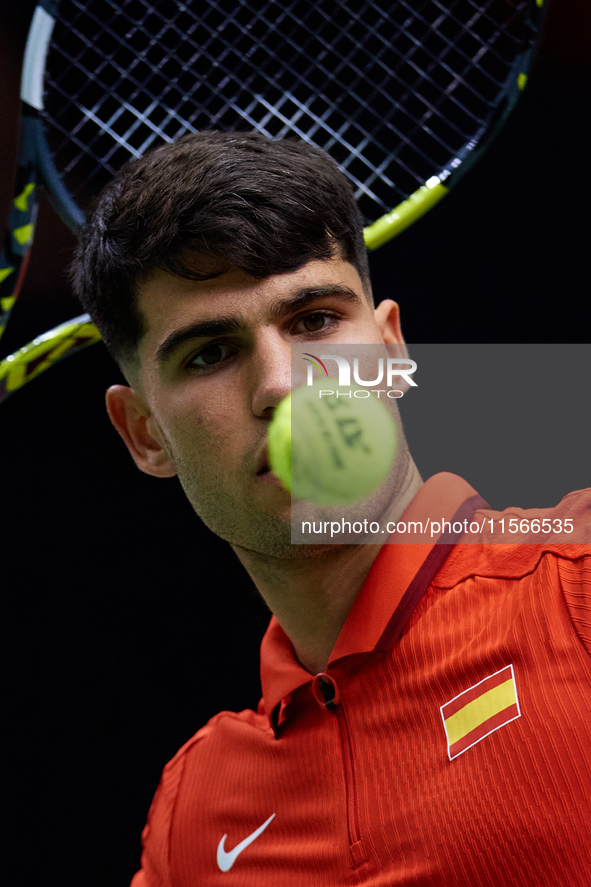 Carlos Alcaraz of Spain looks at the ball following the game against Tomas Machac of Czechia during the 2024 Davis Cup Group B Stage match b...