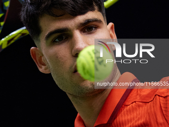 Carlos Alcaraz of Spain looks at the ball following the game against Tomas Machac of Czechia during the 2024 Davis Cup Group B Stage match b...