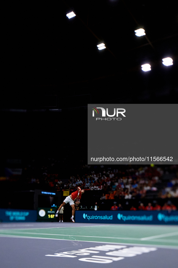 Carlos Alcaraz of Spain serves against Tomas Machac of Czechia during the 2024 Davis Cup Group B Stage match between Czechia and Spain at Pa...