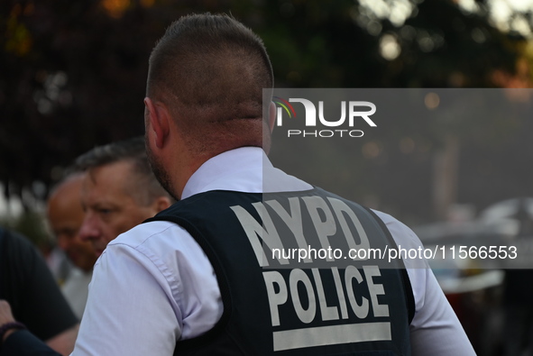 Police guard the crime scene. The New York City Police Department investigates after a man is killed by a gunshot to the head in the East El...