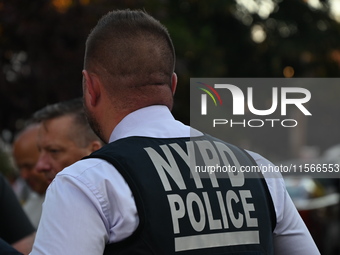 Police guard the crime scene. The New York City Police Department investigates after a man is killed by a gunshot to the head in the East El...