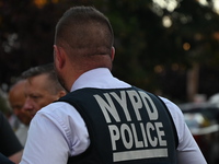 Police guard the crime scene. The New York City Police Department investigates after a man is killed by a gunshot to the head in the East El...