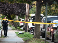 Police guard the crime scene. The New York City Police Department investigates after a man is killed by a gunshot to the head in the East El...