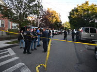 Police guard the crime scene. The New York City Police Department investigates after a man is killed by a gunshot to the head in the East El...