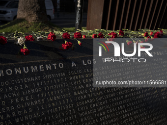 Flowers are left at the memorial of disappeared detainees in Valparaiso, Chile, on the 51st anniversary of the coup. (