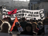 Protesters raise a banner with the figure of Salvador Allende in a commemorative march in Chile on September 11, 2024, 51 years after the co...