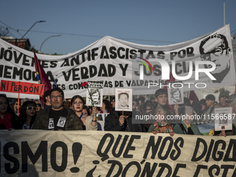 People march through the streets of Valparaiso, Chile, on September 11, 2024, in commemoration of the 51st anniversary of the coup. (