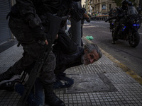 Protesters, including retirees and families, gather outside Argentina's National Congress following President Javier Milei's veto of the Mob...