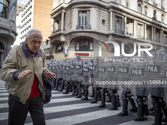 Protesters, including retirees and families, gather outside Argentina's National Congress following President Javier Milei's veto of the Mob...