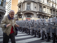 Protesters, including retirees and families, gather outside Argentina's National Congress following President Javier Milei's veto of the Mob...