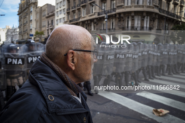 Protesters, including retirees and families, gather outside Argentina's National Congress following President Javier Milei's veto of the Mob...