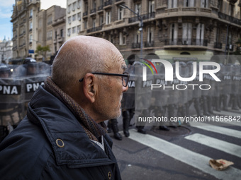 Protesters, including retirees and families, gather outside Argentina's National Congress following President Javier Milei's veto of the Mob...