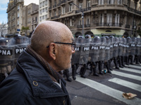 Protesters, including retirees and families, gather outside Argentina's National Congress following President Javier Milei's veto of the Mob...