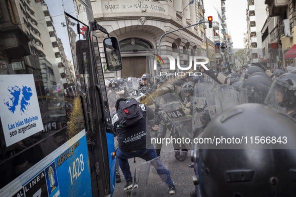 Protesters, including retirees and families, gather outside Argentina's National Congress following President Javier Milei's veto of the Mob...