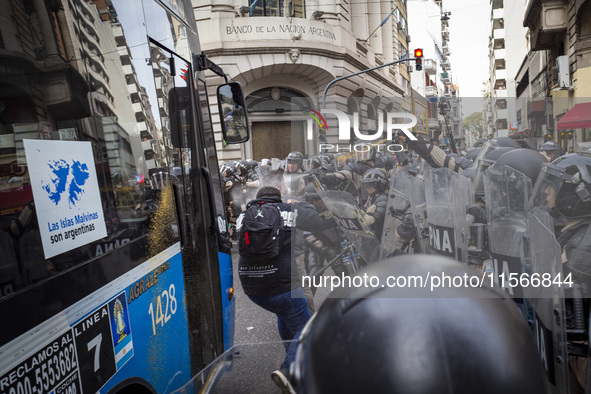 Protesters, including retirees and families, gather outside Argentina's National Congress following President Javier Milei's veto of the Mob...